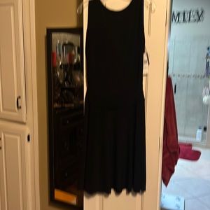 Black dress with a dropped drape back.  Jersey knit so very comfortable.